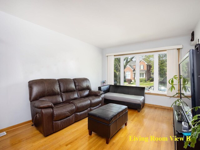 6005 N Canfield Ave, Chicago, IL 60631 - living room with light wood-style flooring and baseboards