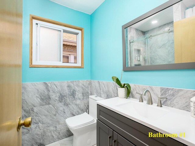 6005 N Canfield Ave, Chicago, IL 60631 - full bathroom with tile walls, toilet, a shower stall, vanity, and marble finish flooring