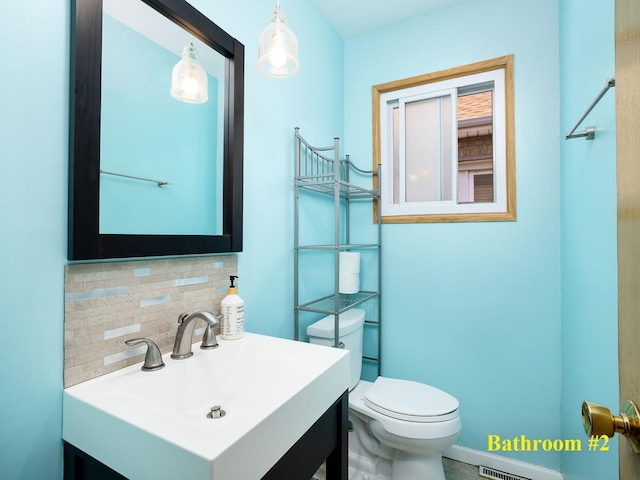 6005 N Canfield Ave, Chicago, IL 60631 - half bath with toilet, tasteful backsplash, and vanity