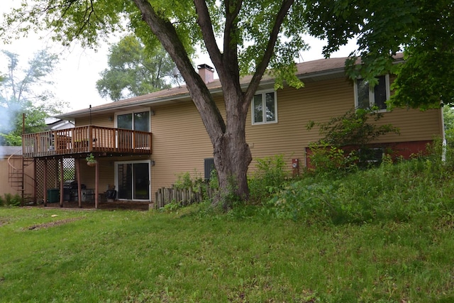 4323 Il Route 176th Ave, Crystal Lake, IL 60014 - back of property with a wooden deck, a lawn, and a chimney