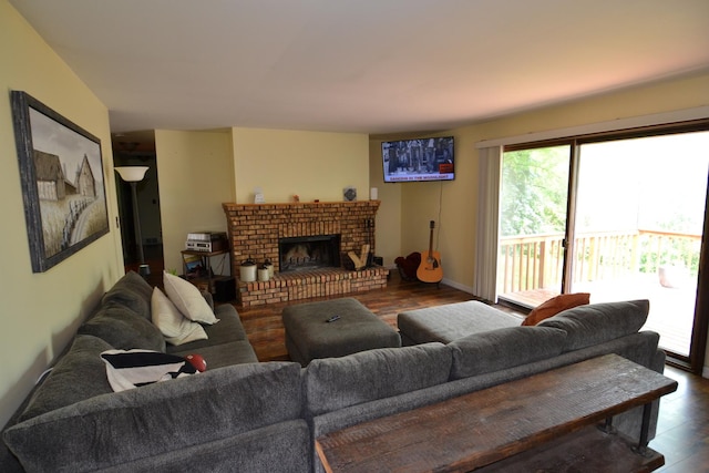 4323 Il Route 176th Ave, Crystal Lake, IL 60014 - living area featuring wood finished floors, a brick fireplace, and baseboards