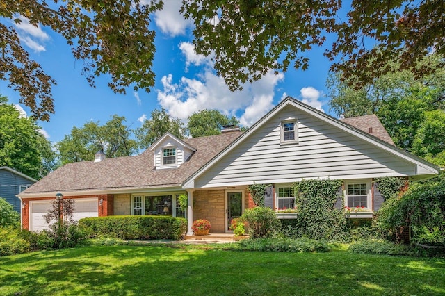 603 Shabbona Trl, Batavia, IL 60510 - view of front of property with a chimney, an attached garage, and a front yard