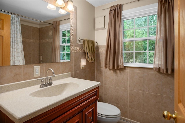 603 Shabbona Trl, Batavia, IL 60510 - bathroom featuring tile walls, vanity, and a shower with shower curtain