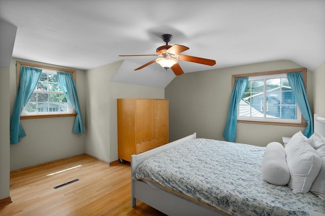 603 Shabbona Trl, Batavia, IL 60510 - bedroom featuring vaulted ceiling, light wood-type flooring, and a ceiling fan