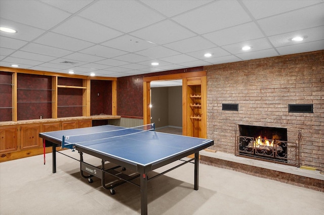 603 Shabbona Trl, Batavia, IL 60510 - rec room with light carpet, a fireplace, recessed lighting, and a paneled ceiling