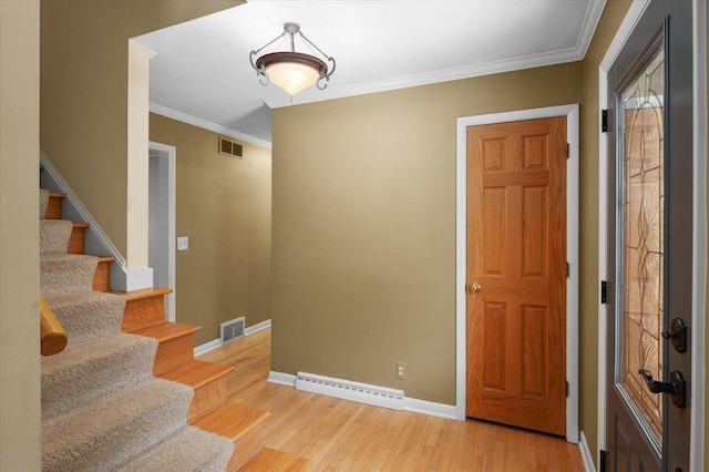 603 Shabbona Trl, Batavia, IL 60510 - entryway with stairs, wood finished floors, and crown molding