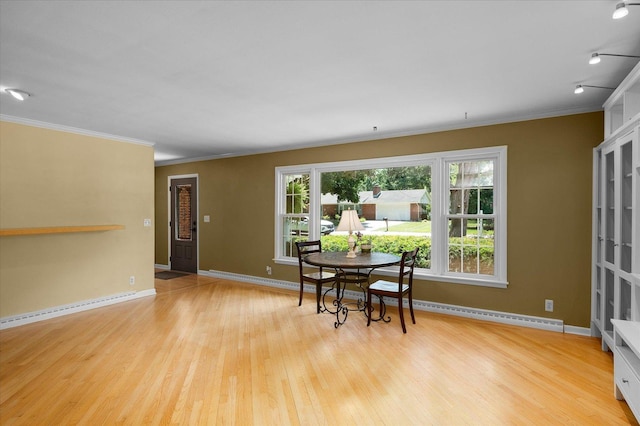 603 Shabbona Trl, Batavia, IL 60510 - dining area with ornamental molding, wood finished floors, a baseboard heating unit, and baseboard heating