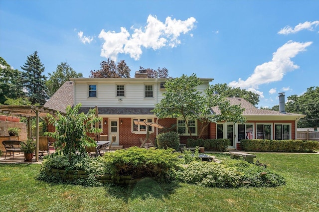 603 Shabbona Trl, Batavia, IL 60510 - rear view of house with a pergola, a chimney, a patio, a lawn, and brick siding