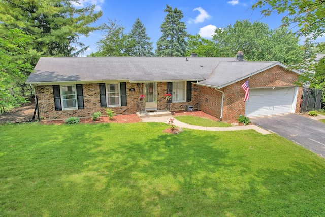508 Falmore Ln, Bolingbrook, IL 60440 - single story home featuring asphalt driveway, a garage, brick siding, and a front yard