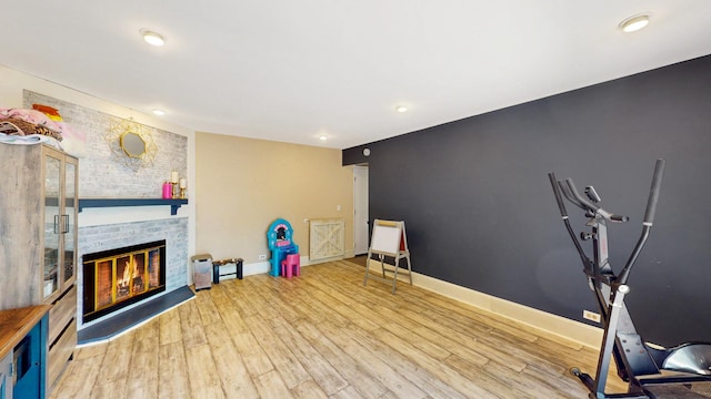 508 Falmore Ln, Bolingbrook, IL 60440 - workout room with a fireplace, wood finished floors, and recessed lighting