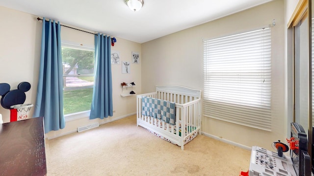 508 Falmore Ln, Bolingbrook, IL 60440 - carpeted bedroom featuring baseboards and a nursery area