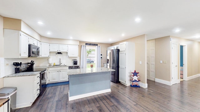 508 Falmore Ln, Bolingbrook, IL 60440 - kitchen with appliances with stainless steel finishes, a center island, white cabinetry, dark wood-type flooring, and recessed lighting