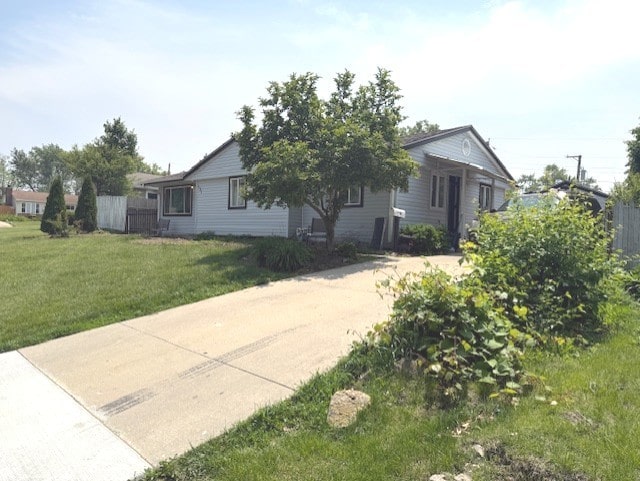 131 Toro Cir, Carpentersville, IL 60110 - view of front of property with a front yard and concrete driveway