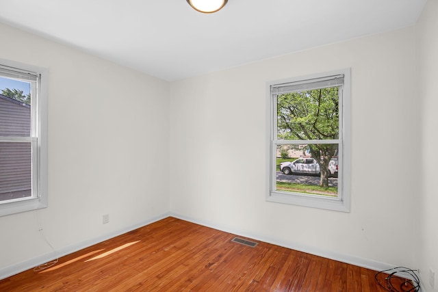 22227 Clyde Ave, Sauk Village, IL 60411 - empty room featuring healthy amount of natural light and wood-type flooring