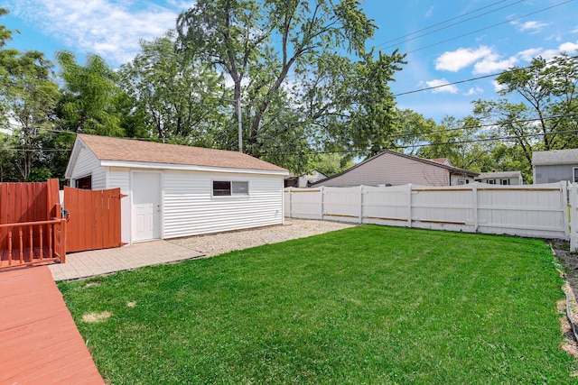 22227 Clyde Ave, Sauk Village, IL 60411 - fenced backyard with an outdoor structure and a gate