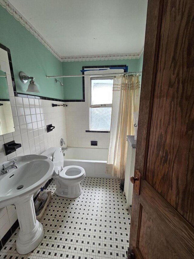 5071 W Pensacola Ave, Chicago, IL 60641 - bathroom with shower / bath combo with shower curtain, tile walls, and crown molding