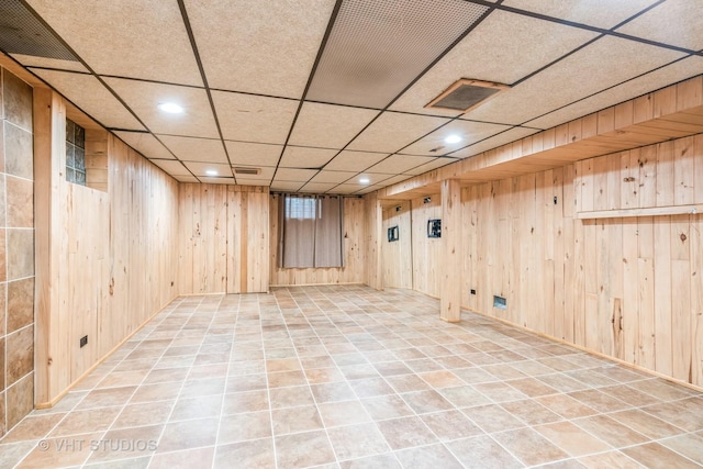945 S Wolf Rd, Des Plaines, IL 60016 - finished below grade area with recessed lighting, a paneled ceiling, and wooden walls