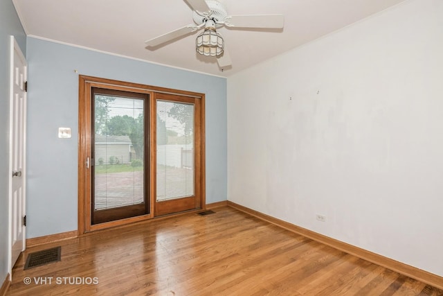 945 S Wolf Rd, Des Plaines, IL 60016 - spare room featuring light wood finished floors, crown molding, and ceiling fan