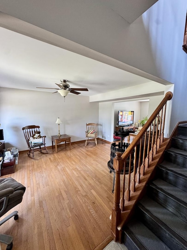 1064 N 129th Infantry Dr, Joliet, IL 60435 - stairway featuring ceiling fan and wood finished floors