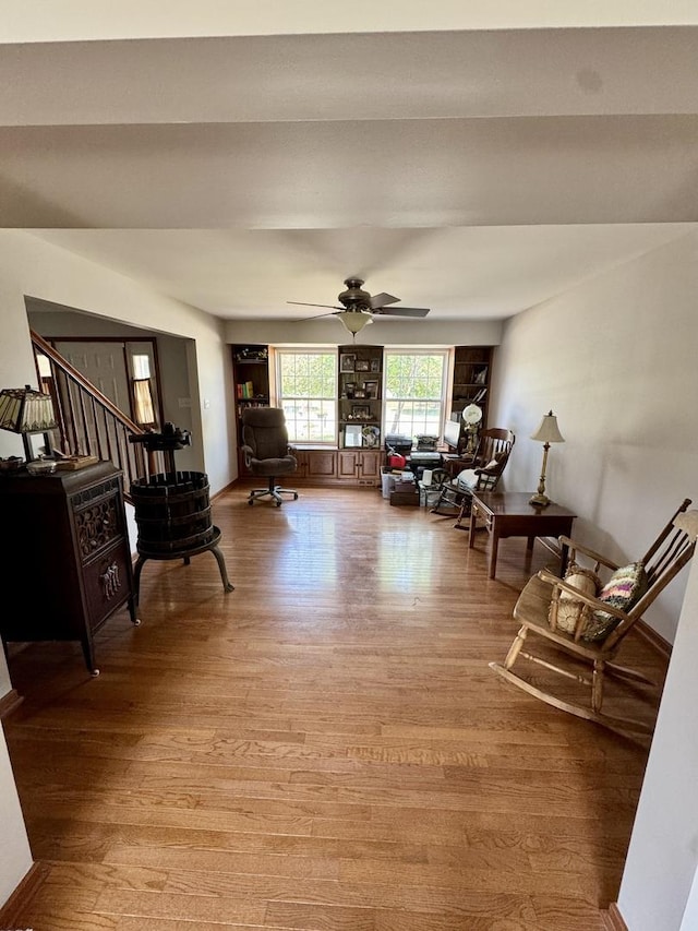 1064 N 129th Infantry Dr, Joliet, IL 60435 - living room featuring light wood-style flooring and a ceiling fan