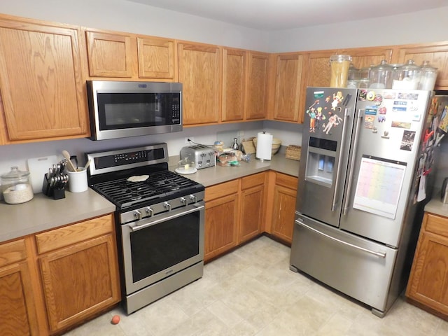 1064 N 129th Infantry Dr, Joliet, IL 60435 - kitchen featuring stainless steel appliances and light countertops
