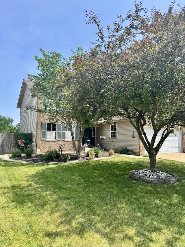 1064 N 129th Infantry Dr, Joliet, IL 60435 - view of property hidden behind natural elements with brick siding, concrete driveway, and an attached garage