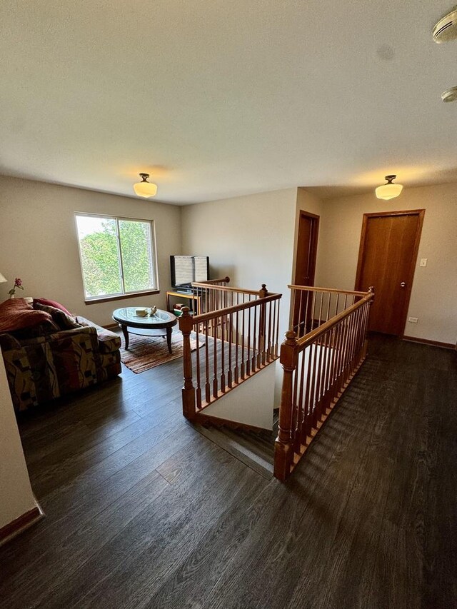 1064 N 129th Infantry Dr, Joliet, IL 60435 - hallway with an upstairs landing and wood finished floors