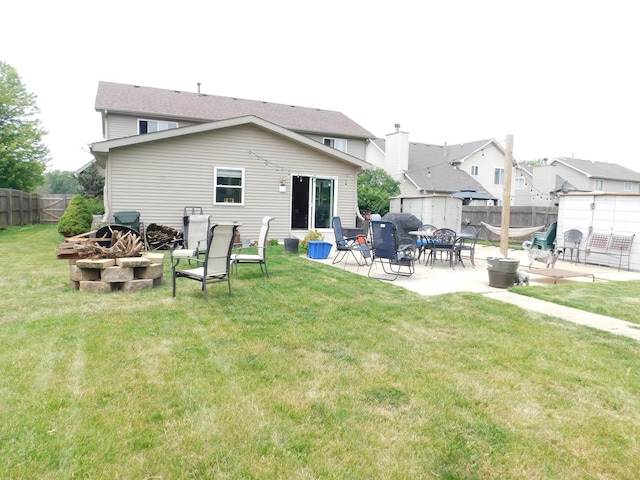 1064 N 129th Infantry Dr, Joliet, IL 60435 - back of house featuring an outdoor fire pit and a patio area