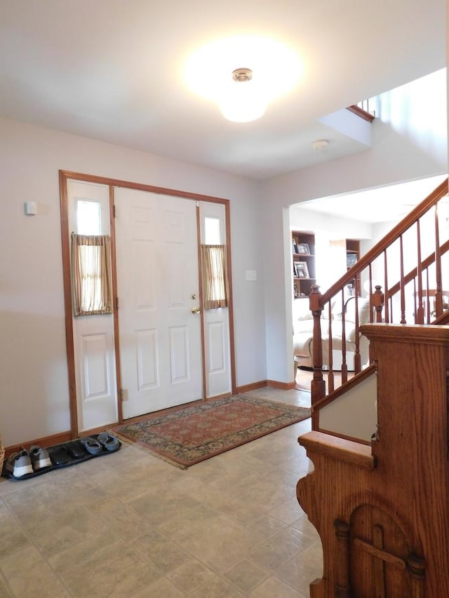 1064 N 129th Infantry Dr, Joliet, IL 60435 - foyer featuring baseboards and stairs