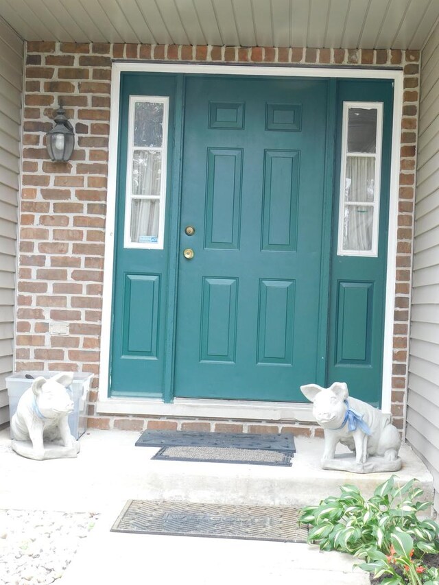 1064 N 129th Infantry Dr, Joliet, IL 60435 - entrance to property with covered porch and brick siding