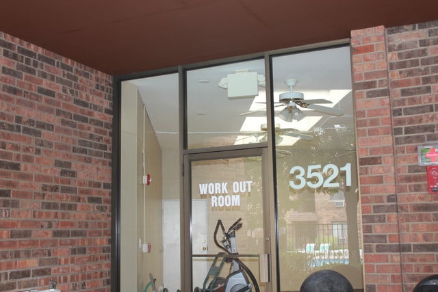 3515 Central Rd Unit 103, Glenview, IL 60025 - view of exterior entry featuring brick siding and ceiling fan