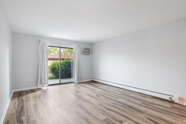 3515 Central Rd Unit 103, Glenview, IL 60025 - unfurnished room with a wall unit AC, wood finished floors, and baseboard heating