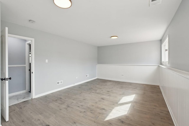 1848 172nd St, East Hazel Crest, IL 60429 - spare room with wood finished floors, a smoke detector, and baseboards