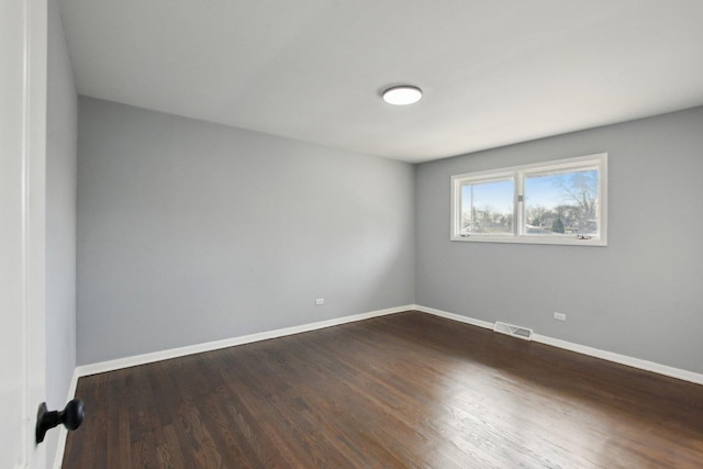 1848 172nd St, East Hazel Crest, IL 60429 - spare room featuring dark wood finished floors and baseboards