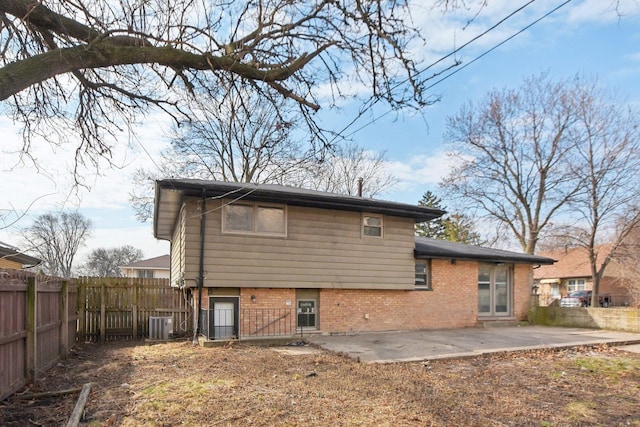 1848 172nd St, East Hazel Crest, IL 60429 - back of house with a patio area, brick siding, a fenced backyard, and central AC