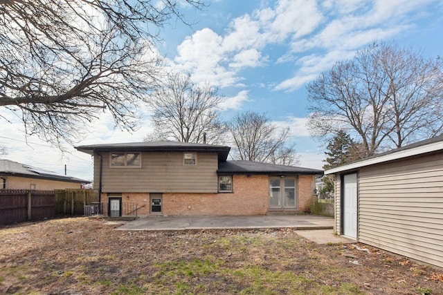 1848 172nd St, East Hazel Crest, IL 60429 - rear view of house with brick siding and a patio