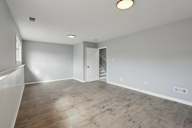 1848 172nd St, East Hazel Crest, IL 60429 - unfurnished room with stairs, baseboards, and wood finished floors