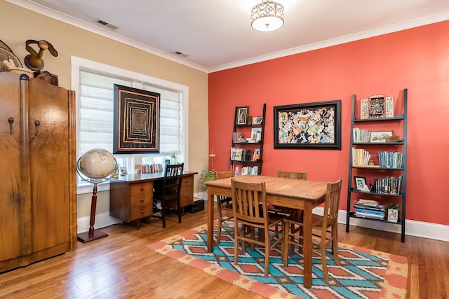 206 S Lombard Ave Unit 206B, Oak Park, IL 60302 - dining room featuring ornamental molding and wood finished floors