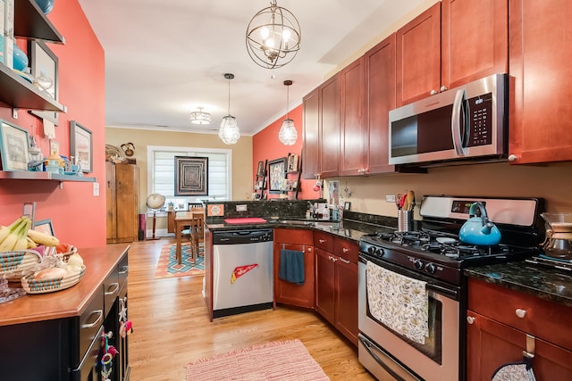 206 S Lombard Ave Unit 206B, Oak Park, IL 60302 - kitchen featuring appliances with stainless steel finishes, crown molding, light wood finished floors, a peninsula, and pendant lighting