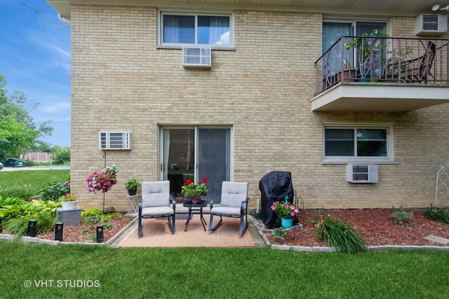 5730 Concord Ln Unit 7, Clarendon Hills, IL 60514 - rear view of house featuring a balcony, a patio, brick siding, and a lawn