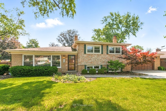 1703 Wilmette St, Wheaton, IL 60187 - split level home with a chimney, a front yard, concrete driveway, and an attached garage