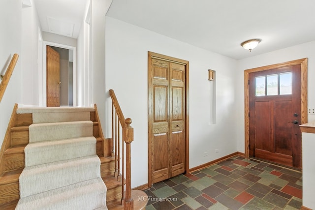 1703 Wilmette St, Wheaton, IL 60187 - entrance foyer featuring baseboards, stairs, and dark stone finish floors