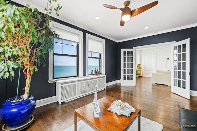 7321 S S Shore Dr Unit 10A, Chicago, IL 60649 - living area featuring radiator, french doors, ornamental molding, a ceiling fan, and wood finished floors