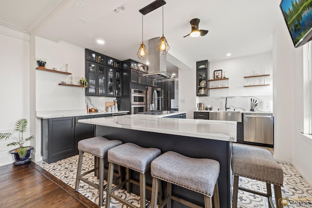 7321 S S Shore Dr Unit 10A, Chicago, IL 60649 - kitchen with open shelves, stainless steel appliances, island exhaust hood, a breakfast bar, and recessed lighting