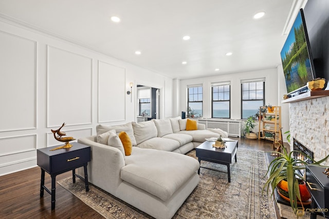 7321 S S Shore Dr Unit 10A, Chicago, IL 60649 - living room with a decorative wall, dark wood-type flooring, radiator, recessed lighting, and crown molding