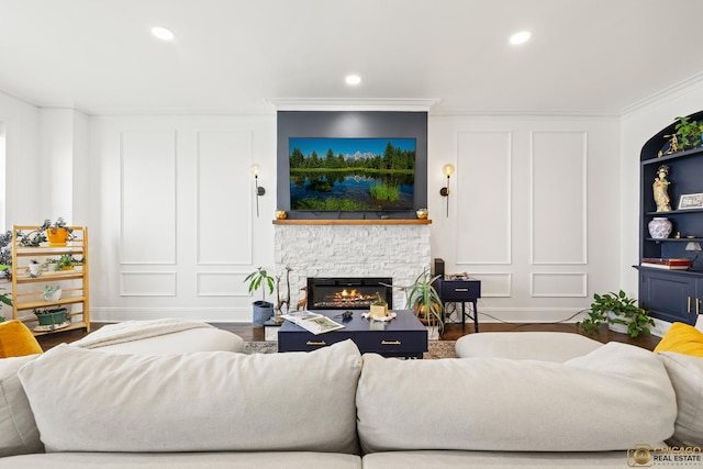 7321 S S Shore Dr Unit 10A, Chicago, IL 60649 - living room featuring crown molding, a fireplace, a decorative wall, recessed lighting, and wood finished floors