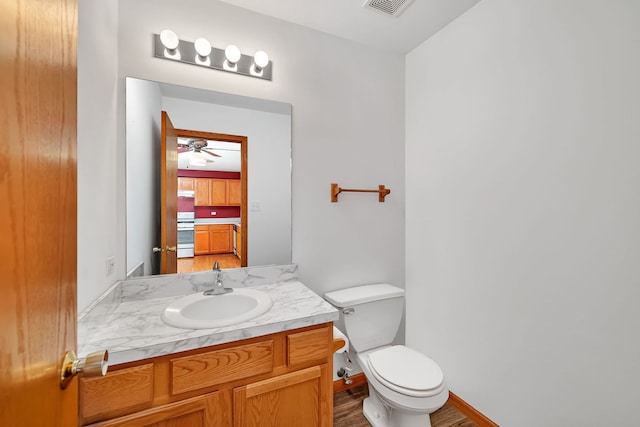 26437 W Deer Path, Channahon, IL 60410 - bathroom featuring toilet, vanity, ceiling fan, and wood finished floors