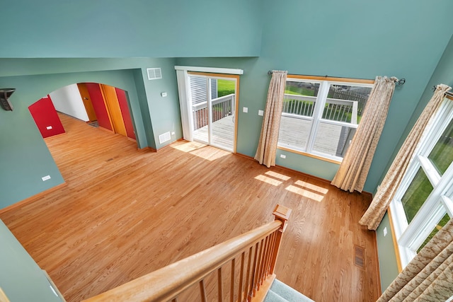 26437 W Deer Path, Channahon, IL 60410 - interior space featuring wood finished floors, arched walkways, and plenty of natural light