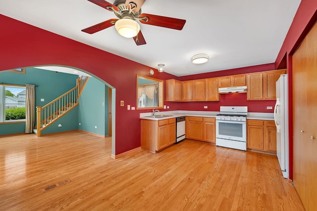 26437 W Deer Path, Channahon, IL 60410 - kitchen featuring white appliances, arched walkways, under cabinet range hood, and light countertops