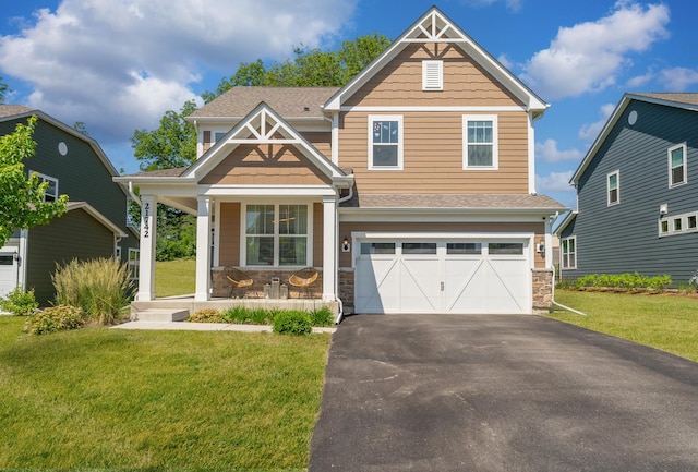21742 N Ashley St, Kildeer, IL 60047 - craftsman house with a porch, stone siding, driveway, and a front lawn